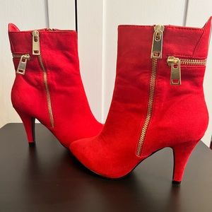 Brand new, maybe worn 1 time around the house. Size 6 red boot heel from DSW